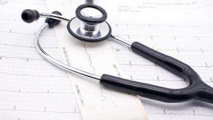 The EKG paper, with a doctor's stethoscope on top (which doctors use to analyze and treat heart disease), is white. © Jaroen