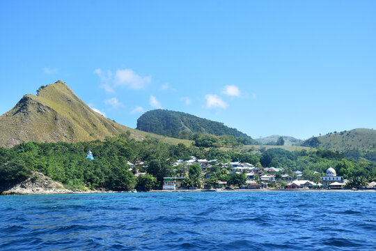 A beautiful view of a remote settlement amidst clear waters on Nuca Molas Island, West Manggarai, Flores, Indonesia