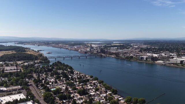 Aerial of Hayden Bay in Portland Oregon on Columbia River in summer with urban landscape and multiple bridges crossings