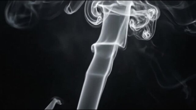 Elegant white smoke rising and swirling on black background