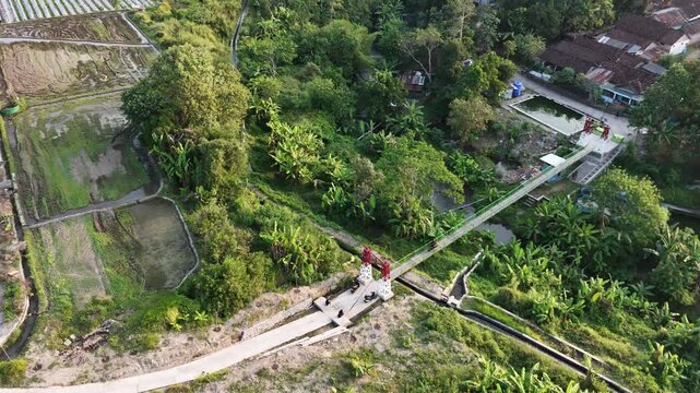 Golden Hour Scooter Ride Across Small Java Bridge.