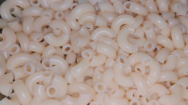Fresh Cooked Elbow Macaroni Pasta Plain Yellow Textured Food Background