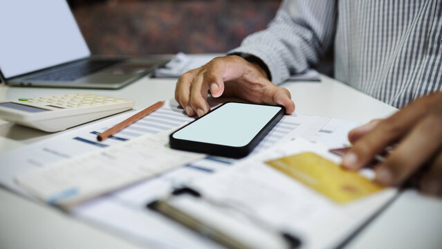 close-up shot, man hand using mobile phone to online shopping and paying via credit card, home shopping, online shoping concept