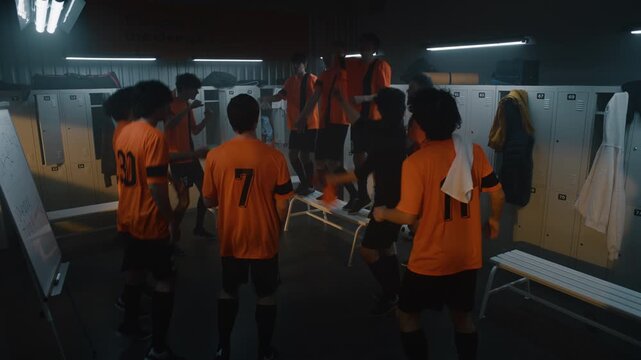 Jubilant Teenage Erupt in Wild Victory Dance. Boys Seized by Raw Euphoria after Championship Win, Diverse Squad Jumps, Shouts, and Triumphantly Removes and Tosses Orange Jerseys. Pure Uninhibited Joy.