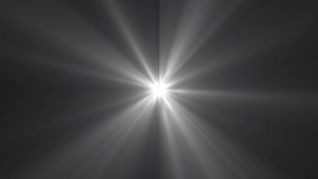Shining sun light rays lens flares animation footage. Smooth appearance of light lens flare. Dramatic light rays emanating on black background. Sun rays perspective view and light beams streaming.