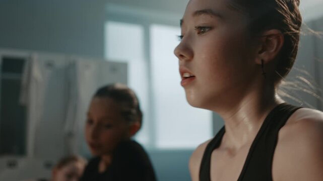 Sweaty Teammates Sit Together, Wiping Sweat, Drinking Water, and Consoling One Another While Discussing Toxic Discipline and High Performance Requirements. Teenage Stress, Endurance in Elite Sports.