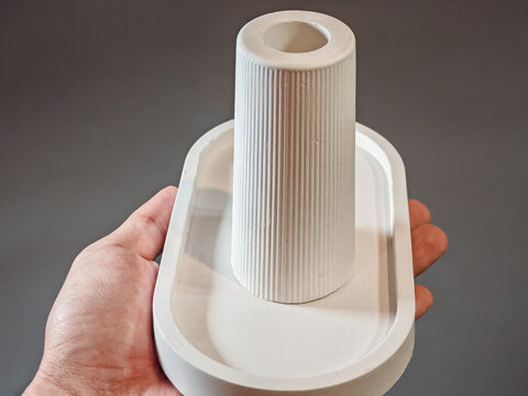 Minimal white ceramic candle holder displayed as a modern home decor object, showing elegant handmade design, clean geometric shapes, and contemporary interior styling