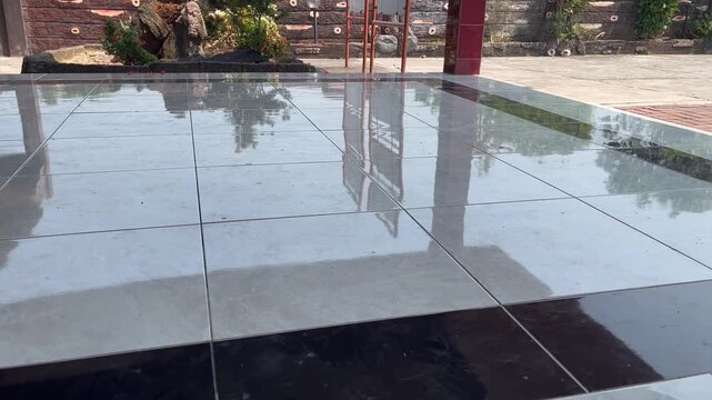 Polished white ceramic tile flooring with clean glossy surface texture