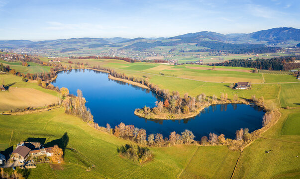 Panorama aerial image of the Gerzensee Lake and village in Bern Oberland, Switzerland