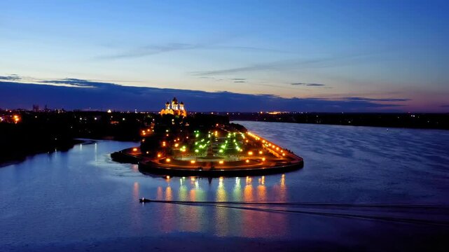 Yaroslavl, Russia. Strelka (Spit), Kotorosl flows into the Volga River. City lights after sunset, twilight. Drone footage
