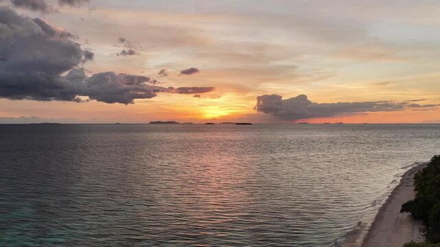 Aerial view of sunset behind anchored boats, Serenity Island, Fiji