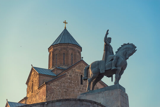 King Vakhtang Gorgasali monument with Metekhi church in Tbilisi at sunset with copy space