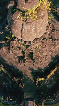 Bajra Sandhi or Monumen Taman Mumbul monument to the struggle for independence in the rays of the rising sun. Bali, Indonesia. 4K Aerial view