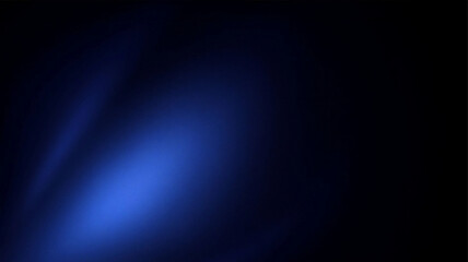 Dark blue background with spotlight. Glowing beam of light on black. Moody atmosphere. © uimostafa