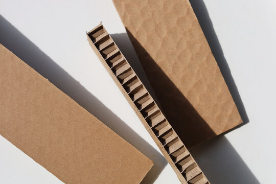 Thick brown honeycomb paper padding for shockproof product packaging.