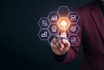 Fototapeta premium Businessman interacting with glowing digital strategy and growth icons on a virtual touch screen interface