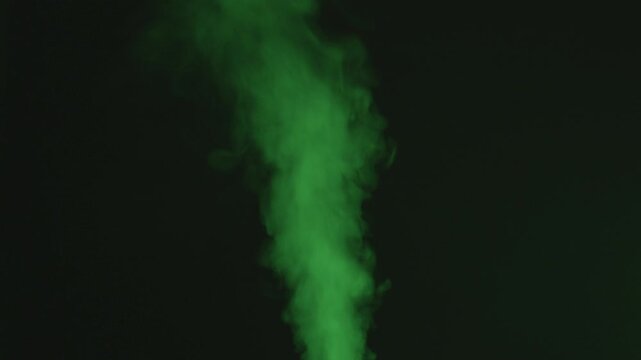 Green Smoke Gradually Intensifying Then Stopping on Black Background
