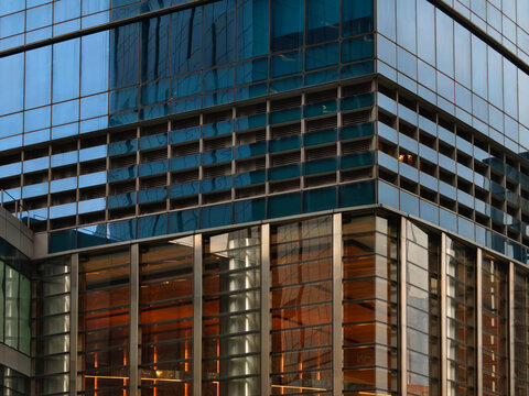 Contemporary glass structure emphasizing sleek reflections and horizontal repetition