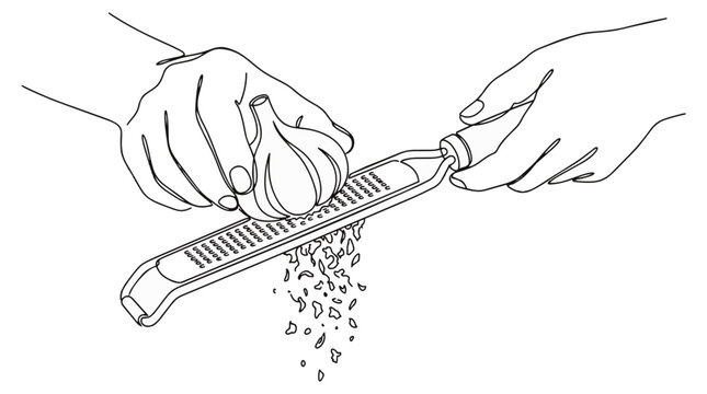 Hands grating fresh garlic bulb with a fine hand zester