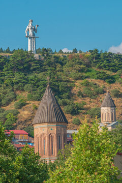 Mother of Georgia monument with ancient church domes in old Tbilisi with copy space