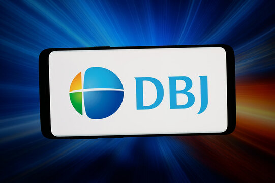 Stuttgart, Germany - 07-08-2026: In this photo illustration, the logo of Development Bank of Japan Inc. (DBJ) is displayed on a smartphone in front of abstract background on computer screen.
