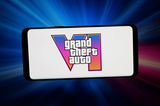 Stuttgart, Germany - 07-08-2026: In this photo illustration, the logo of video game Grand Theft Auto VI (GTA) is displayed on a smartphone in front of abstract background on computer screen.