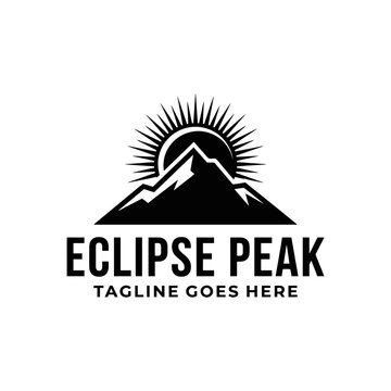Mountain summit silhouette partially obscured radiating sun for eclipse peak adventure hiking nature outdoor logo design