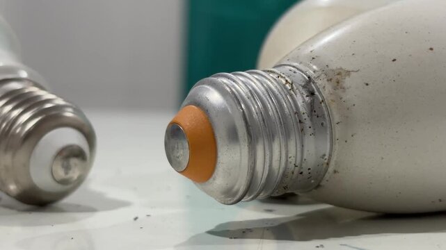 Close-up view of a few old Edison screw light bulb lying on a tabletop. Electricity concept.
