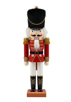 a detailed, close-up macro shot of a classic wooden nutcracker soldier figurine in a crimson uniform with gold braiding and a tall black shako, isolated on a transparent background. concept of