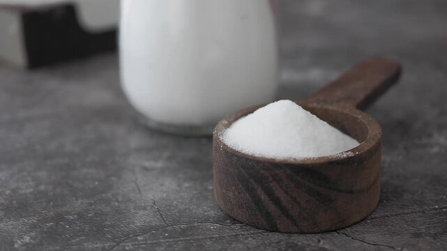 baking soda powder in a spoon for cleaning 