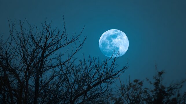 Majestic blue moon illuminating the night sky with glowing lunar surface, deep space atmosphere, celestial beauty, cosmic astronomy background, dreamlike universe, mystical moonlight, high detail spac