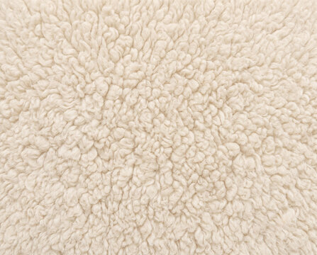 Luxurious cream teddy sherpa upholstery fabric texture seamless plush fleece textile background for premium furniture and interior design