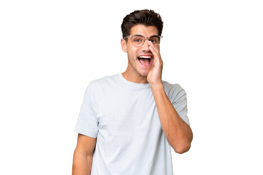 Young caucasian handsome man over isolated background with surprise and shocked facial expression