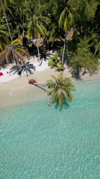 Explore the tranquil shores of Koh Kood, Thailand, where crystal-clear waters meet soft sandy beaches. Enjoy the vibrant palms and peaceful atmosphere perfect for relaxation and escape.