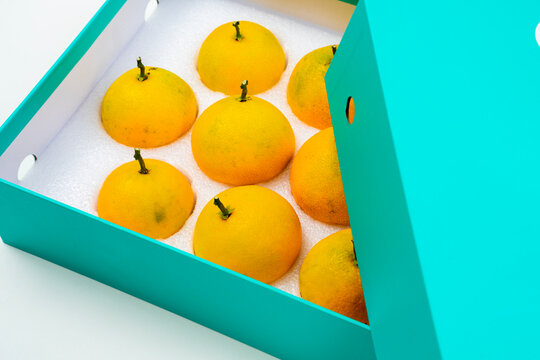 Fresh oranges on a white background