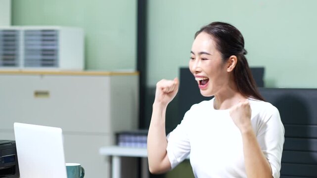 Overjoyed asian excited woman, happy smiling, getting bonus money.