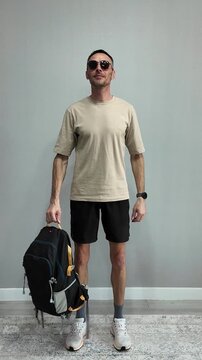Creative stop-motion style video showing a man getting dressed for a journey. He starts in underwear, jumps, and lands fully dressed
