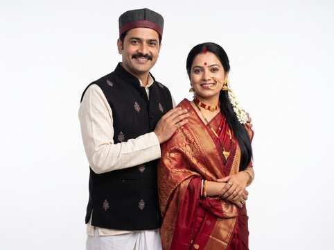 Smiling Uttarakhand Couple in Traditional Attire on White Background