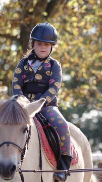 Young girl practice horse riding in slow motion