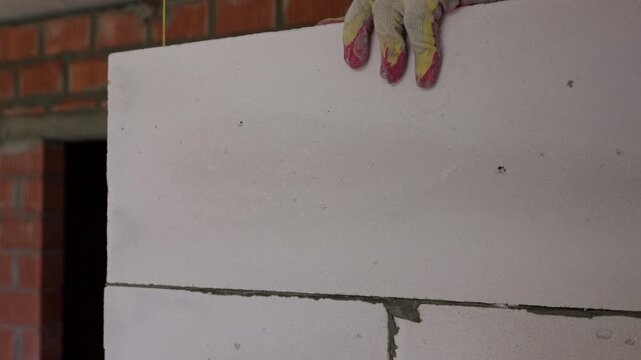 Installing aerated concrete block during interior wall construction