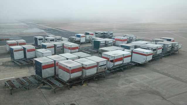 Delayed Airport Cargo Containers In Fog