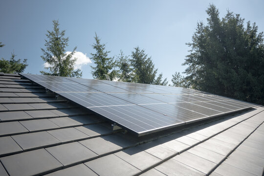 Photovoltaic panels on the house roof. Electricity generation.
