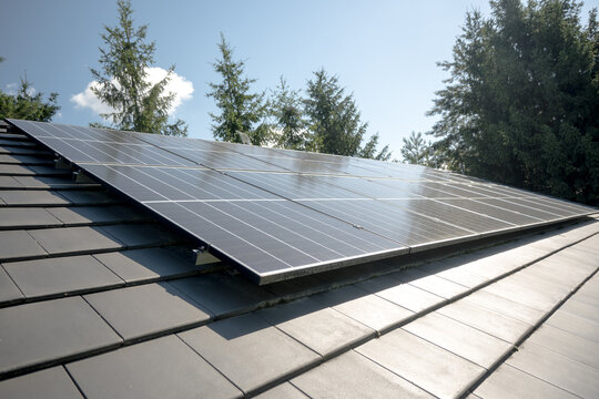 Photovoltaic panels on the house roof. Electricity generation.
