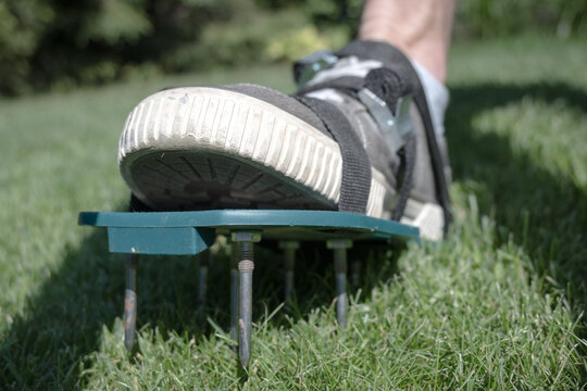 Lawn aeration using shoe attachments.