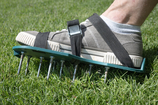 Lawn aeration using shoe attachments.
