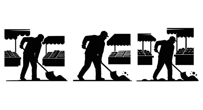 Silhouette of man mowing lawn with push mower.