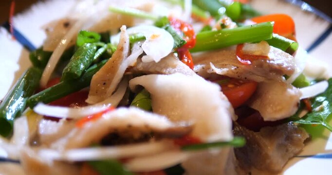 Close up of spicy Thai pork salad Yum Moo Yor