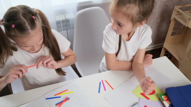 Authentic Home Education Scene Showing Emotional Peer Learning and Trial-and-Error Process