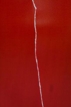 Red Torn Paper Background with Vertical Rip and Minimal Abstract Texture