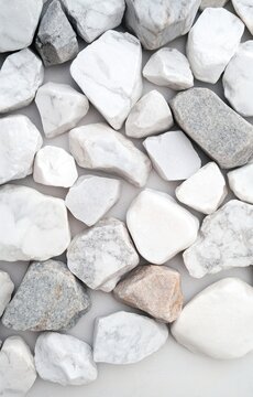 A collection of white and gray stones on a plain surface